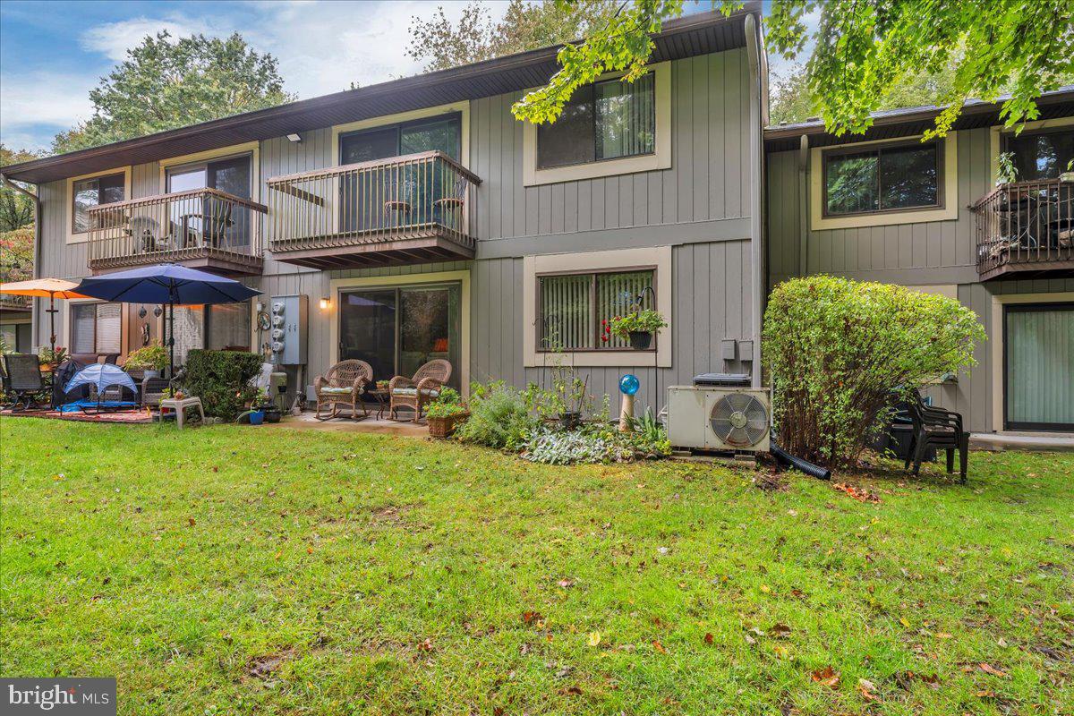 115 East Kings Highway, Unit 443 Maple Shade, NJ 08052 - Photo 23 of 24 a front view of a house with garden