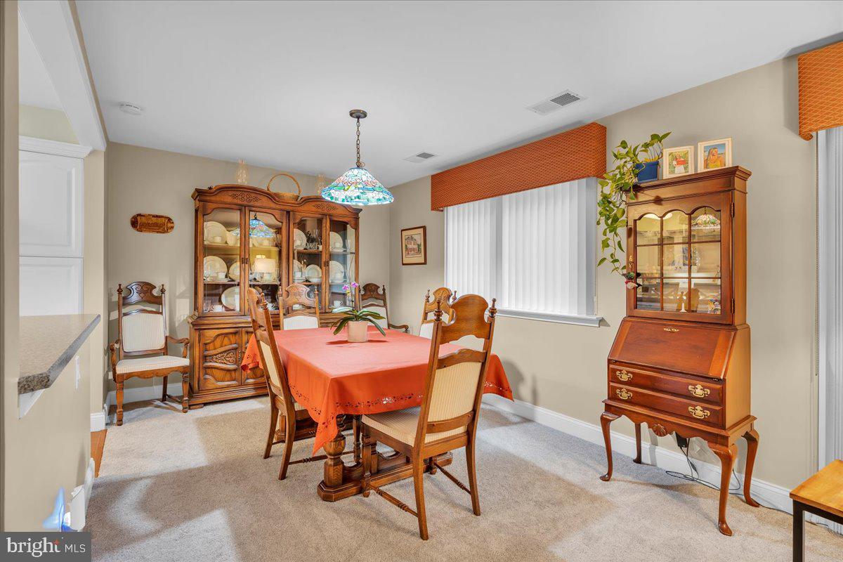 115 East Kings Highway, Unit 443 Maple Shade, NJ 08052 - Photo 9 of 24 a view of a dining room with furniture