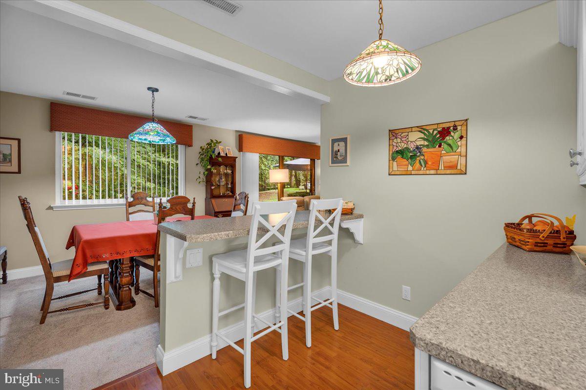 115 East Kings Highway, Unit 443 Maple Shade, NJ 08052 - Photo 10 of 24 a view of a dining room with furniture window and wooden floor