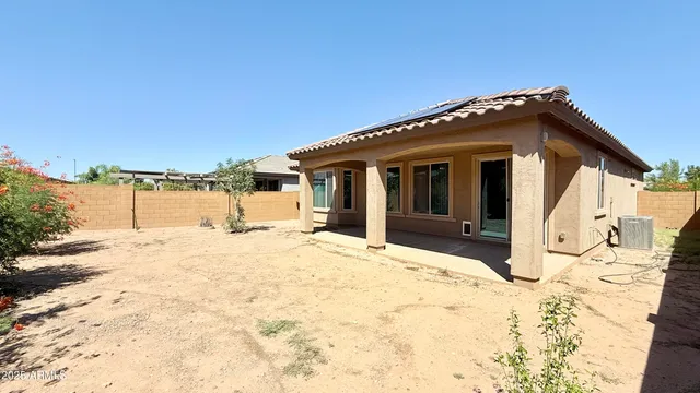 a view of a house with snow on the road