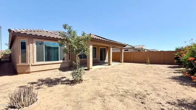 a view of a house with snow on the wall
