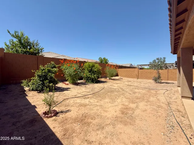 a view of swimming pool with a yard