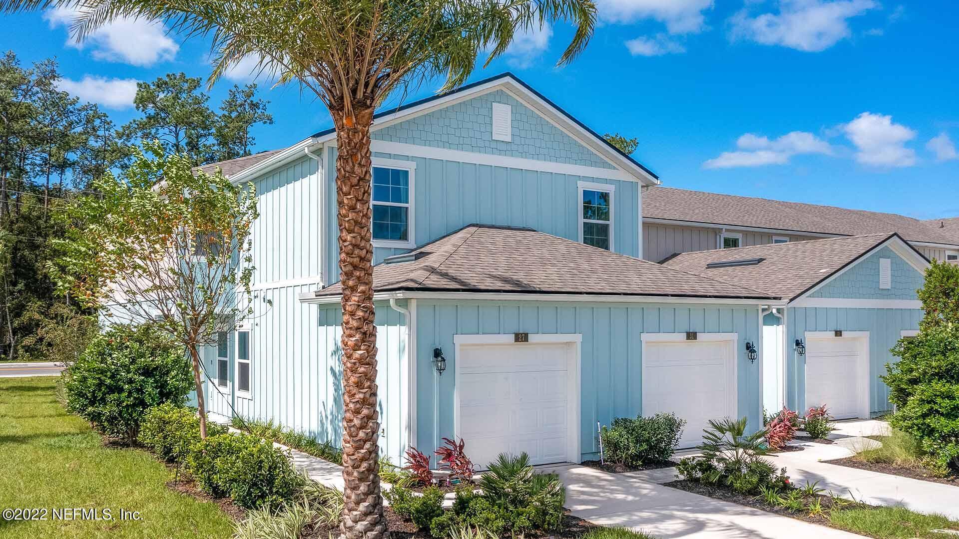 55 Blue Hvn Road St. Augustine, FL 32095 - Photo 2 of 46 a front view of a house with garden
