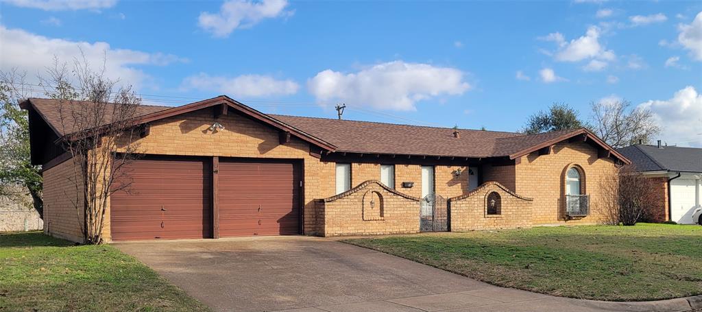 7813 Pebbleford Road Fort Worth, TX 76134 - Photo 1 of 23 a front view of a house with a yard and garage