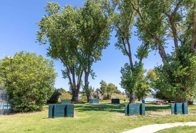 a view of a lake with houses in the background