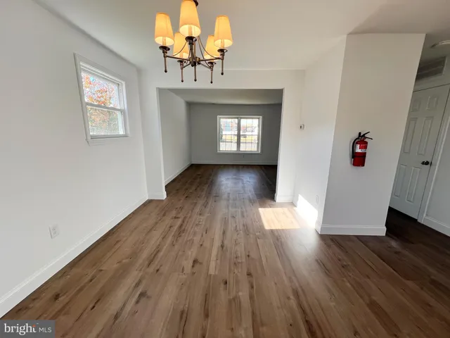 a view of gallery with wooden floor