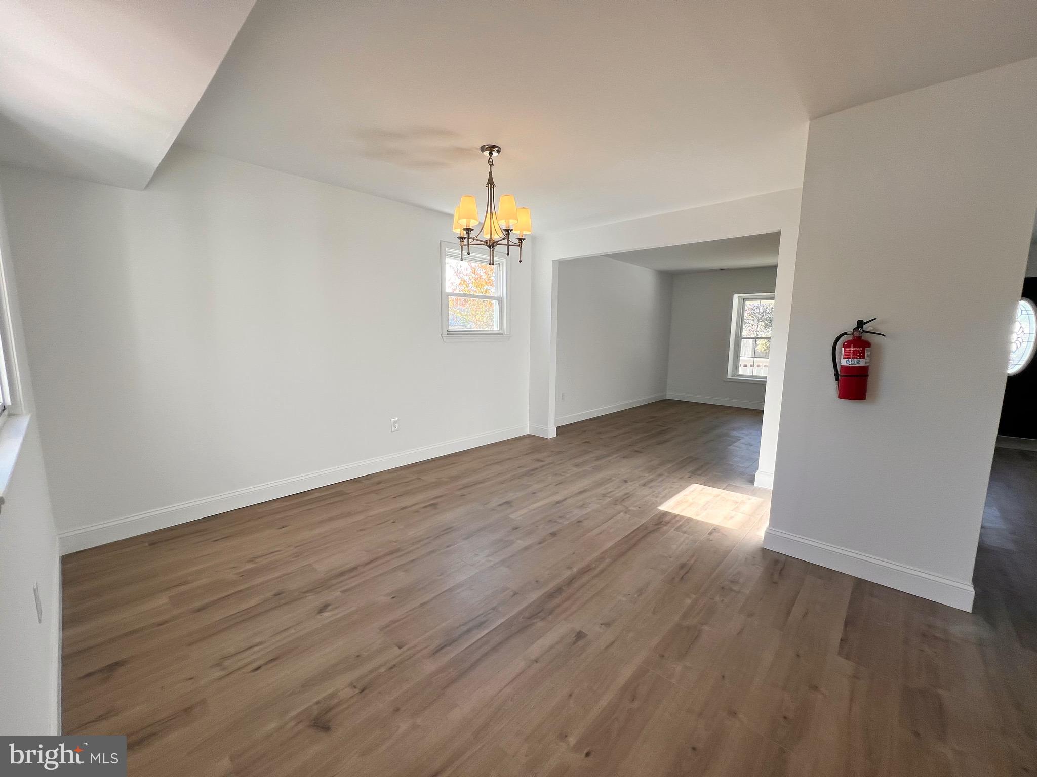 934 North Beecham Road Williamstown, NJ 08094 - Photo 5 of 26 an empty room with wooden floor and window