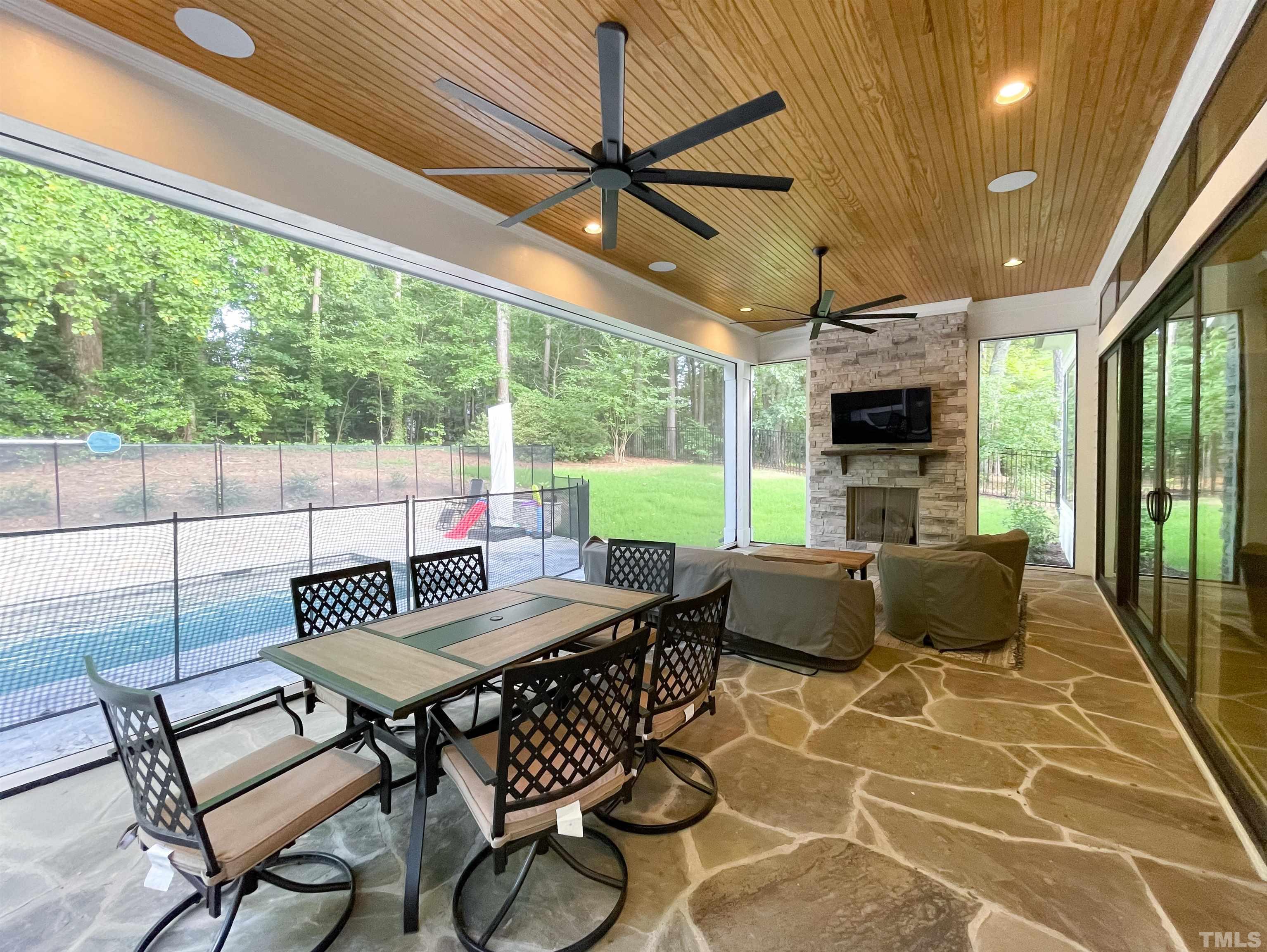 7824 Harps Mill Road Raleigh, NC 27615 - Photo 15 of 17 a dining room with furniture and a floor to ceiling window
