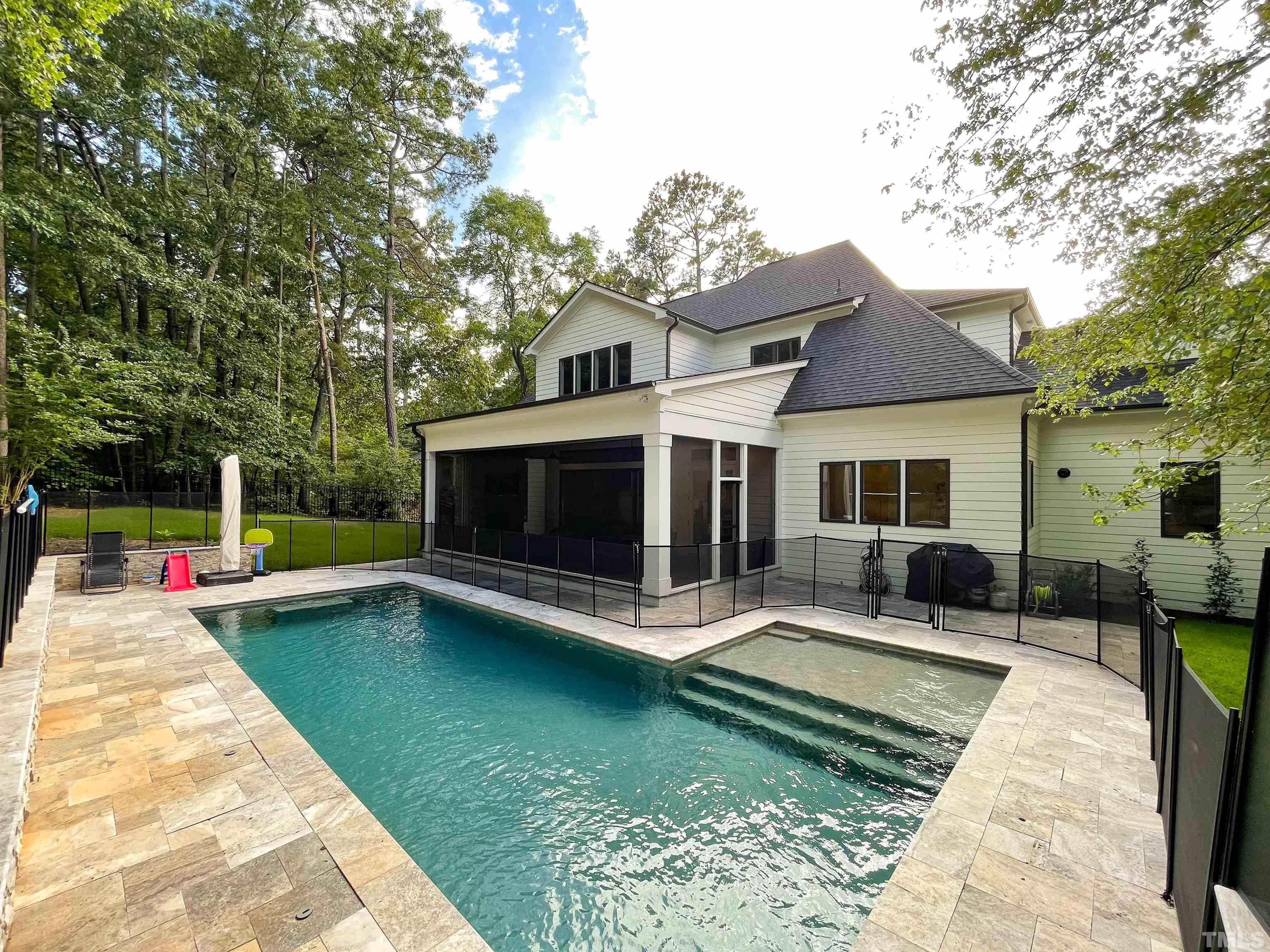 7824 Harps Mill Road Raleigh, NC 27615 - Photo 16 of 17 a view of a house with swimming pool and a yard