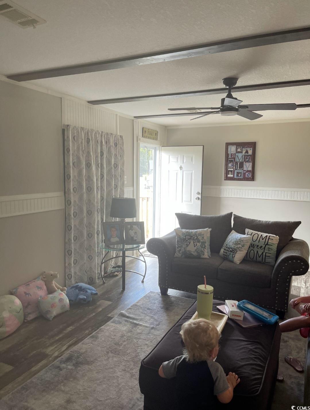 2470 Wigley Road Loris, SC 29569 - Photo 11 of 30 Living area featuring wood finished floors and ceiling fan