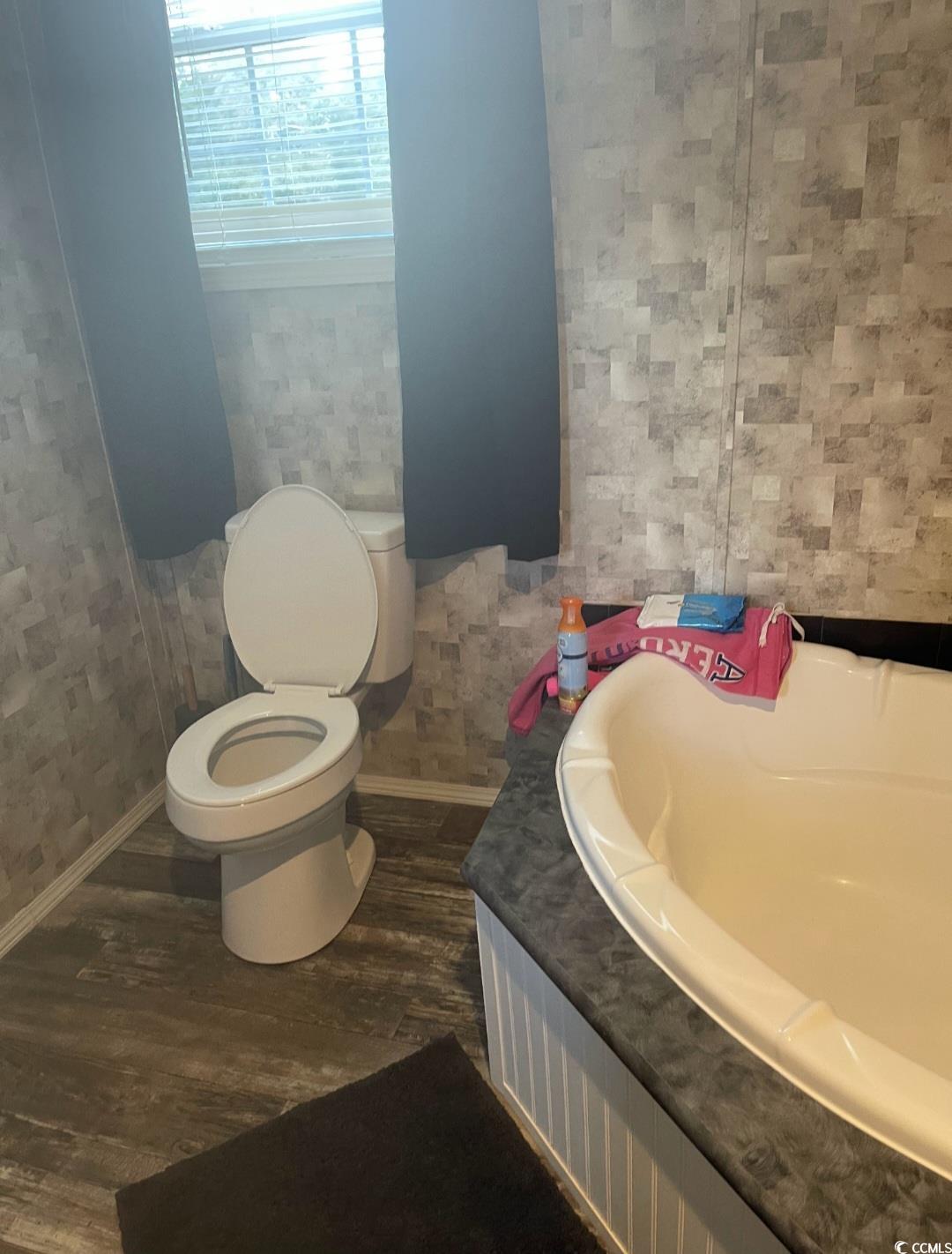 2470 Wigley Road Loris, SC 29569 - Photo 19 of 30 Bathroom featuring dark wood-type flooring and vanity