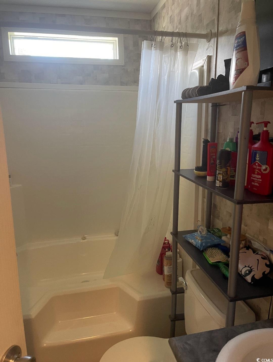 2470 Wigley Road Loris, SC 29569 - Photo 25 of 30 Full bathroom with toilet and shower / bath combo with shower curtain