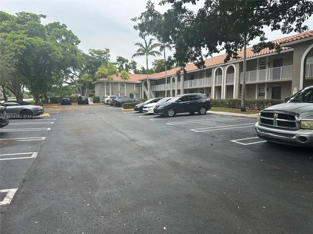 a view of street with parked cars
