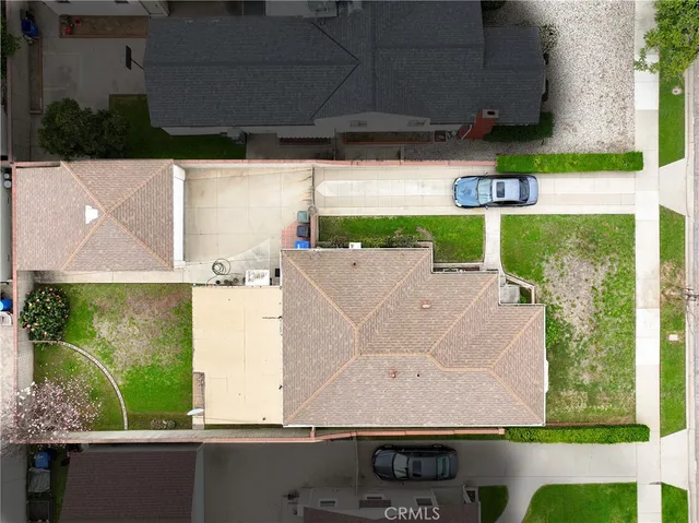 an aerial view of house with yard