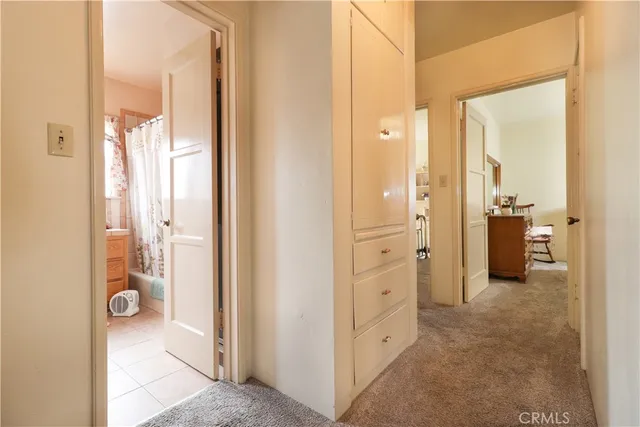 a view of a bathroom with a shower and a sink