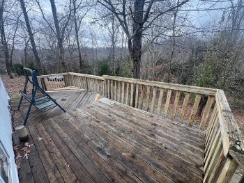 3845 Wickham Road Palmyra, TN 37142 - Photo 2 of 12 a view of deck with mountain view and wooden floor