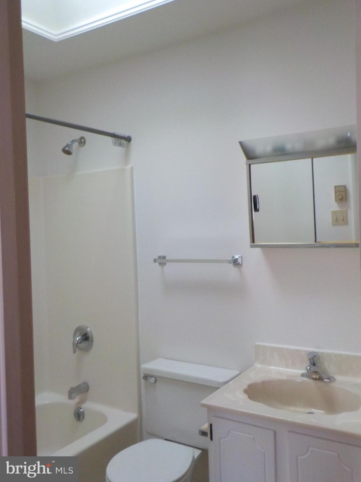 4 Justin Court Lititz, PA 17543 - Photo 11 of 14 a bathroom with a sink a toilet and shower