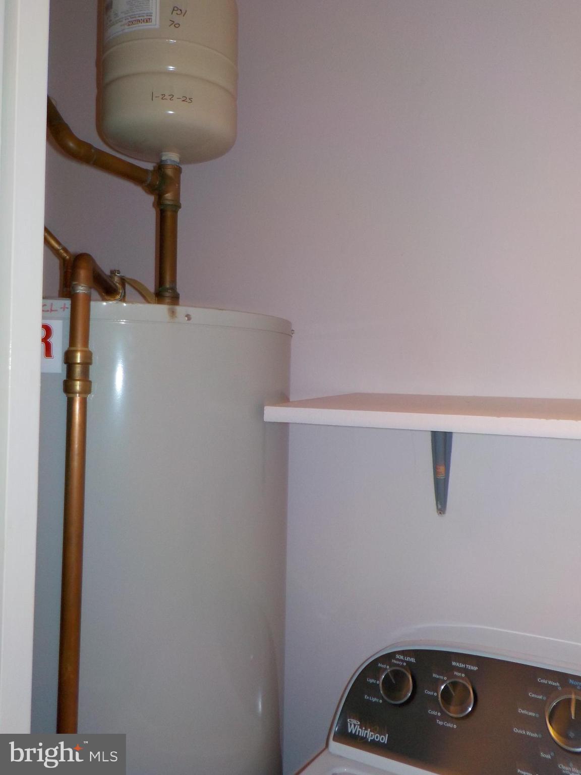4 Justin Court Lititz, PA 17543 - Photo 13 of 14 a room with water heater and wooden cabinets