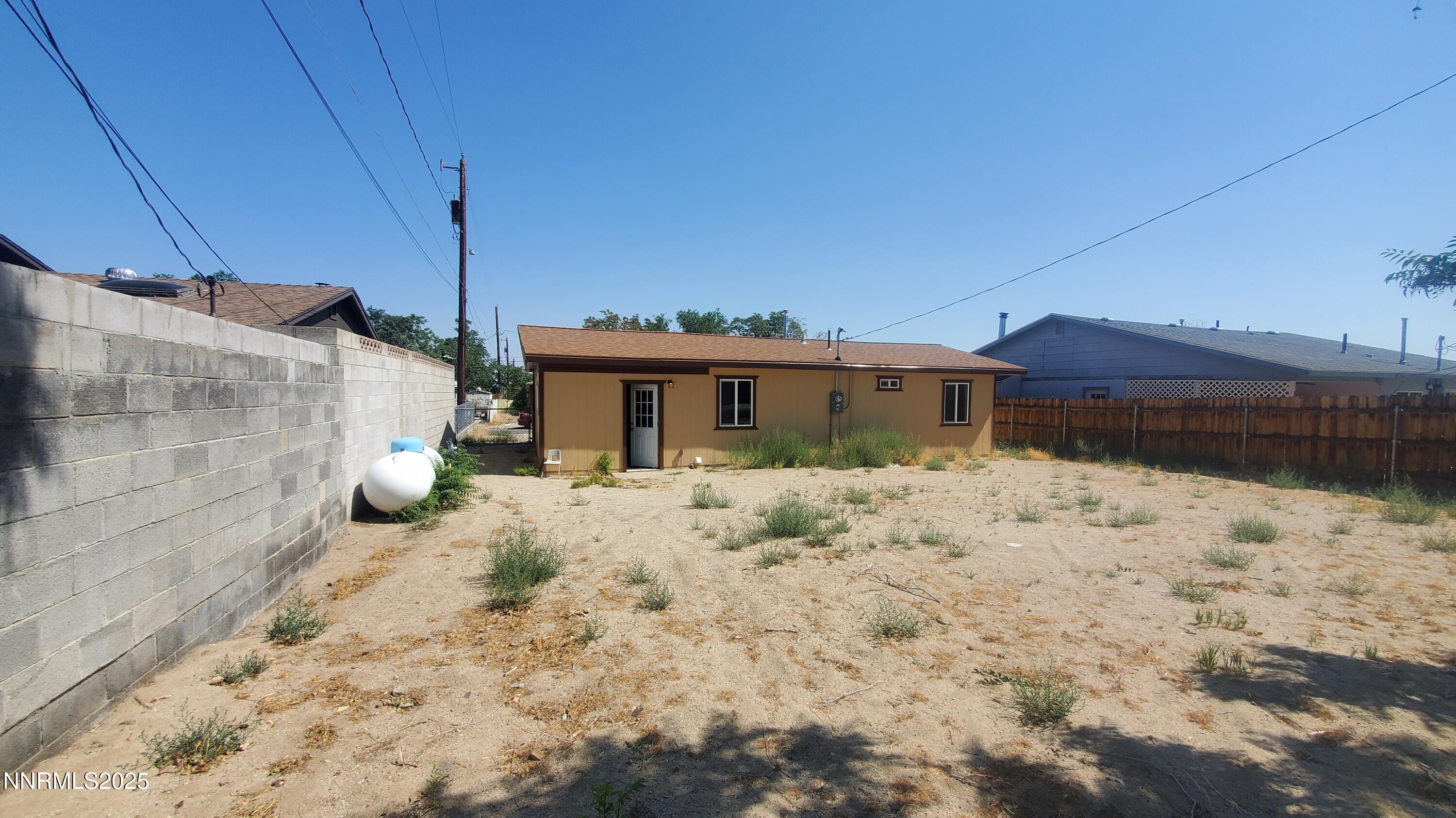 122 Harrison Street Hawthorne, NV 89415 - Photo 13 of 18 a view of a house with a yard