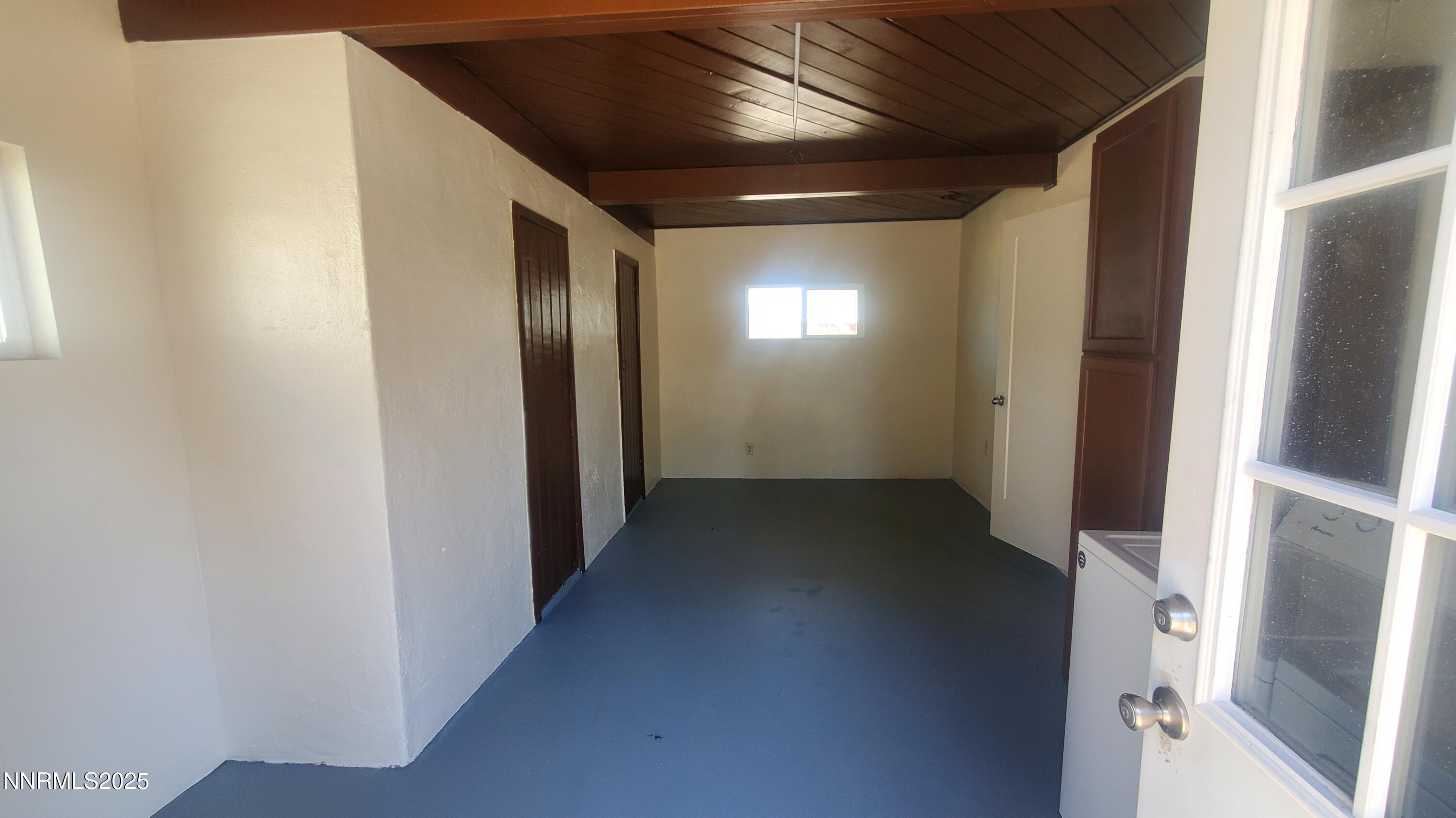 122 Harrison Street Hawthorne, NV 89415 - Photo 14 of 18 a view of hallway with stairs and wooden floor