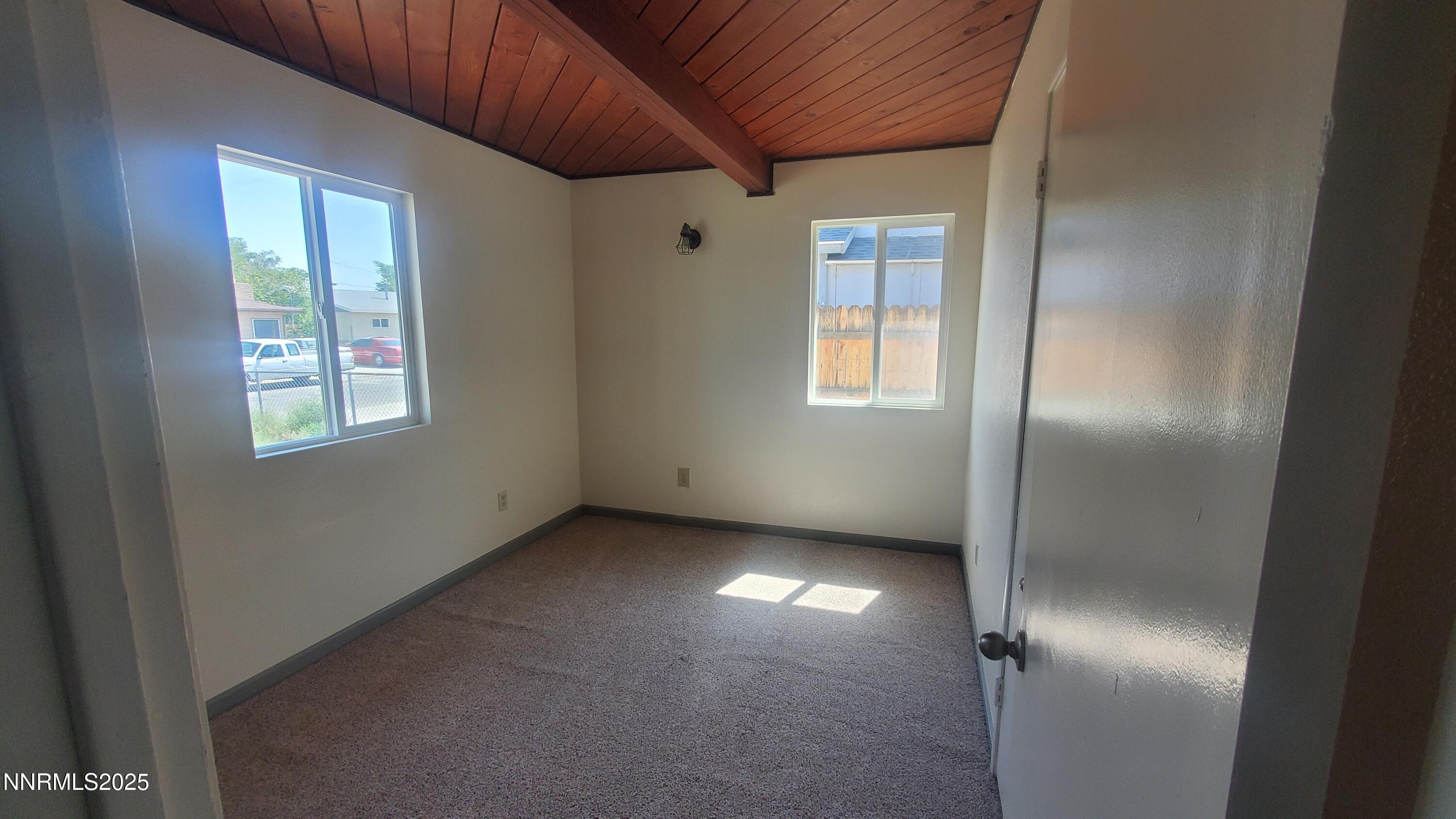122 Harrison Street Hawthorne, NV 89415 - Photo 7 of 18 a view of an empty room with a window