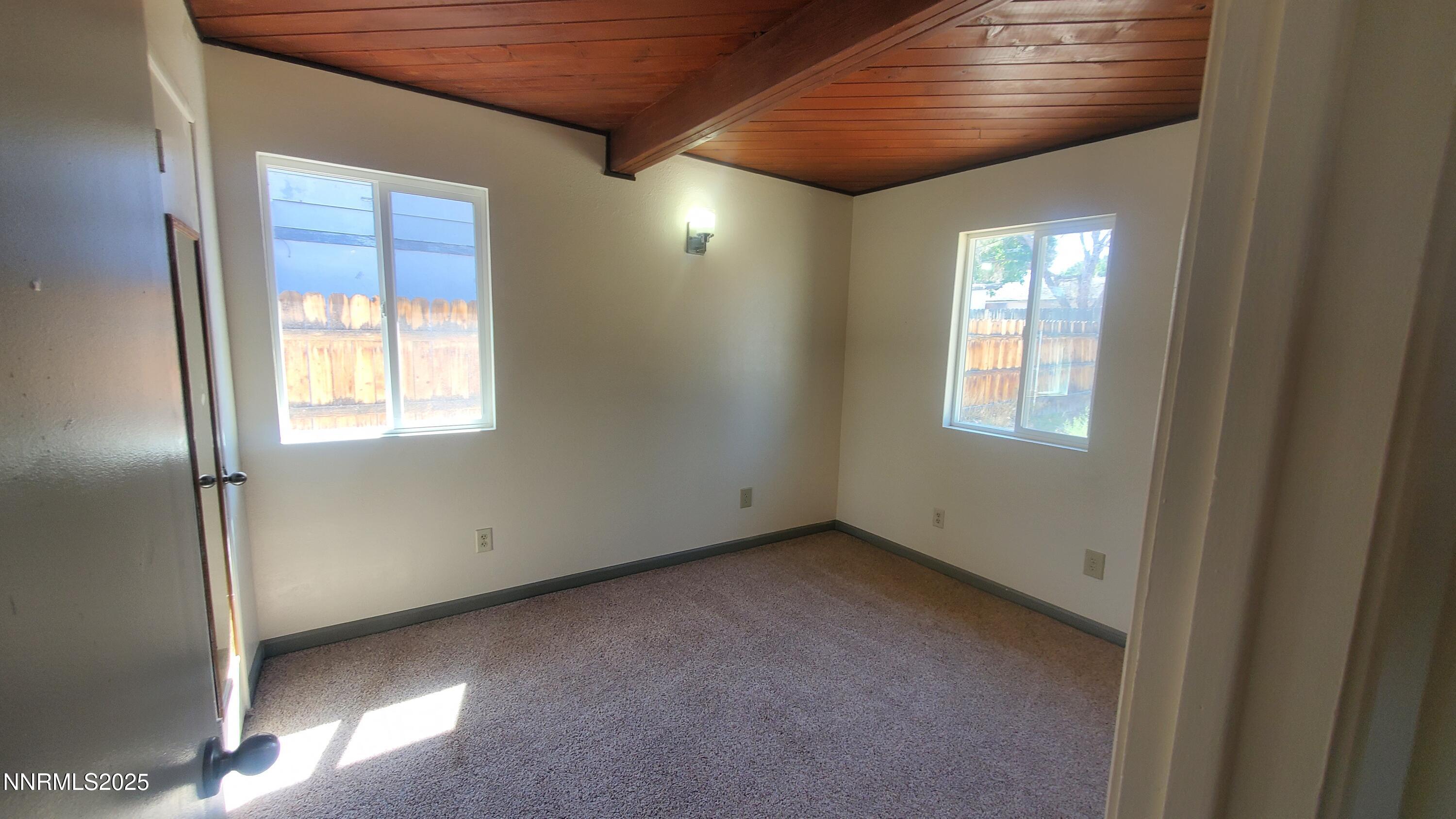 122 Harrison Street Hawthorne, NV 89415 - Photo 8 of 18 an empty room with windows