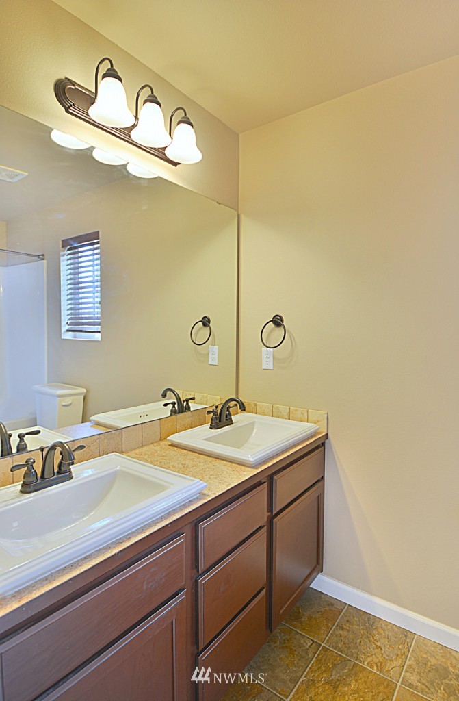 21010 39th Drive Southeast Bothell, WA 98021 - Photo 14 of 22 a bathroom with a sink and a mirror