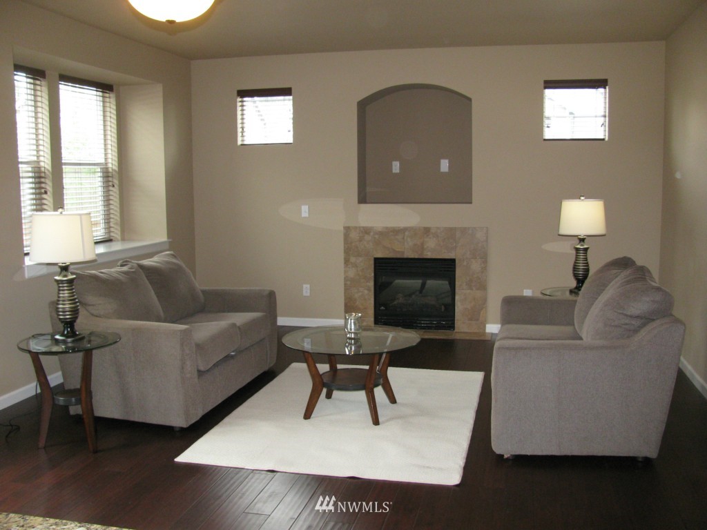 21010 39th Drive Southeast Bothell, WA 98021 - Photo 22 of 22 a living room with furniture and a fireplace