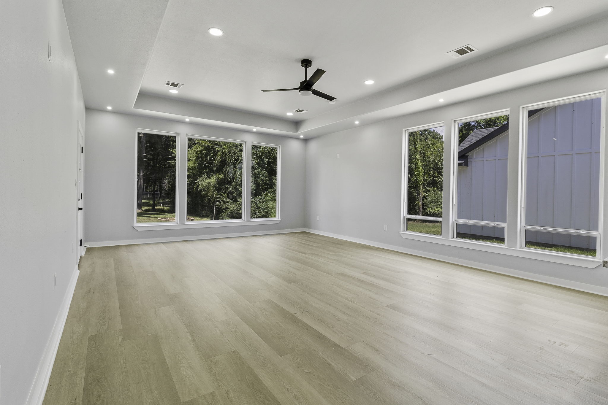 599 Bridgeview Drive Onalaska, TX 77360 - Photo 8 of 27 a view of an empty room with a window and wooden floor
