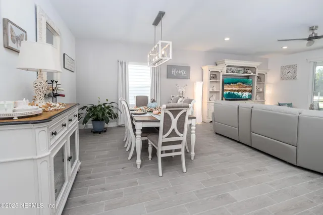 a bedroom with a bed and a refrigerator