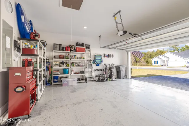 a front view of a house with yard and green space