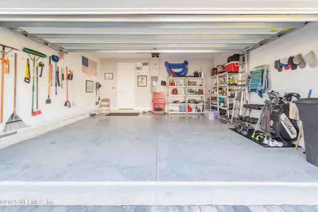 an aerial view of a house with a garden and swimming pool