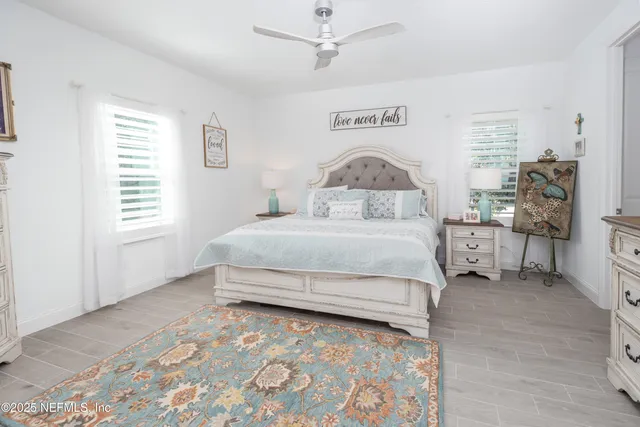 a bedroom with a large bed and a table