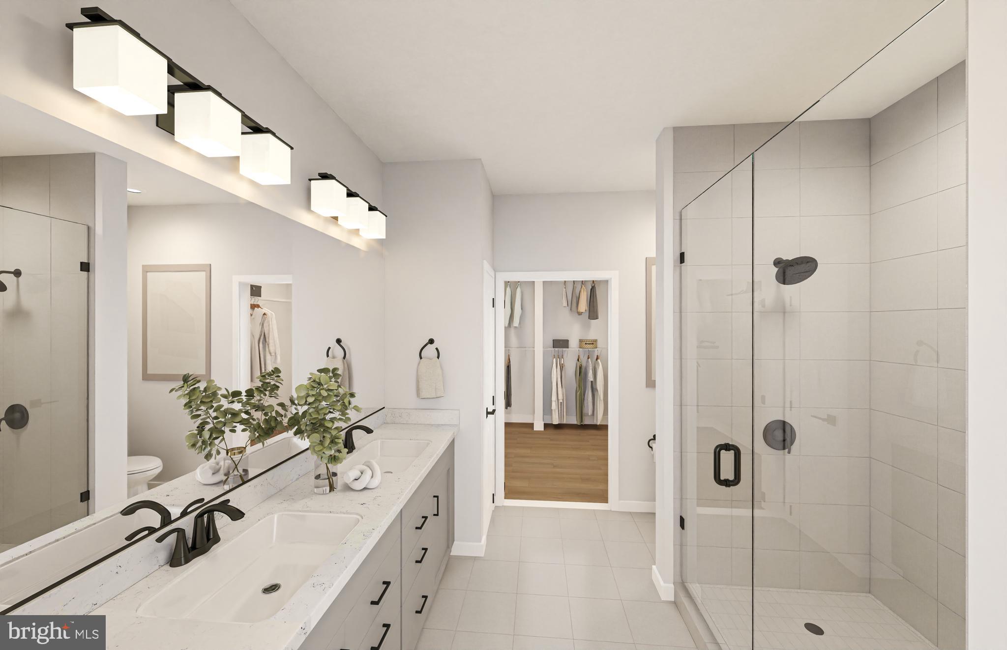 1121 Fortune Terrace, Unit 403 Potomac, MD 20854 - Photo 5 of 11 a bathroom with a tub sink mirror and shower