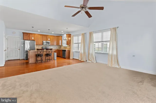 a view of a livingroom with furniture window and wooden floor