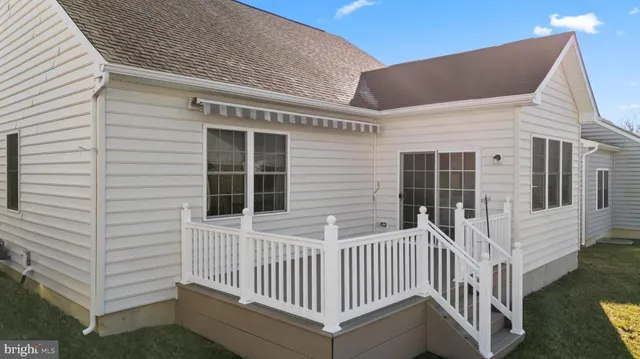 a view of a house with a small yard