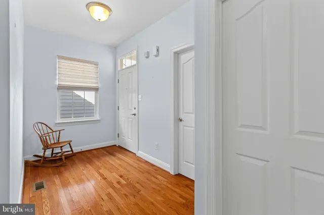 a view of room with window and wooden floor