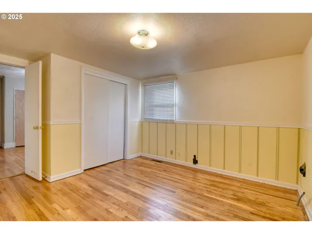 a view of room with wooden floor