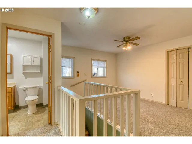 a view of a hallway with a bathroom
