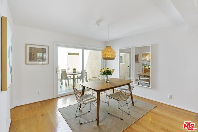a view of a workspace room with furniture and wooden floor