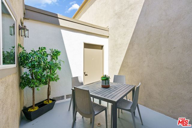 a table and chairs in a patio