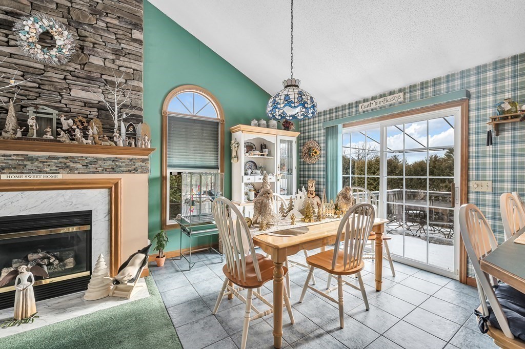 59 Scenic Road Westfield, MA 01085 - Photo 14 of 41 a dining room with furniture a fireplace and chandelier
