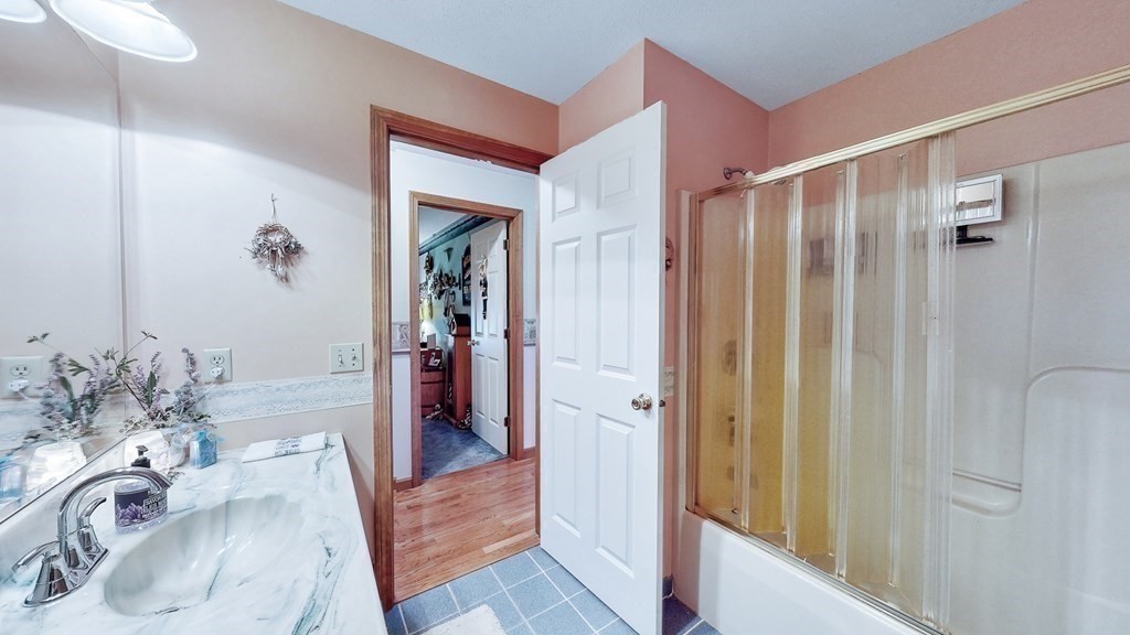 59 Scenic Road Westfield, MA 01085 - Photo 19 of 41 a bathroom with a tub sink and mirror