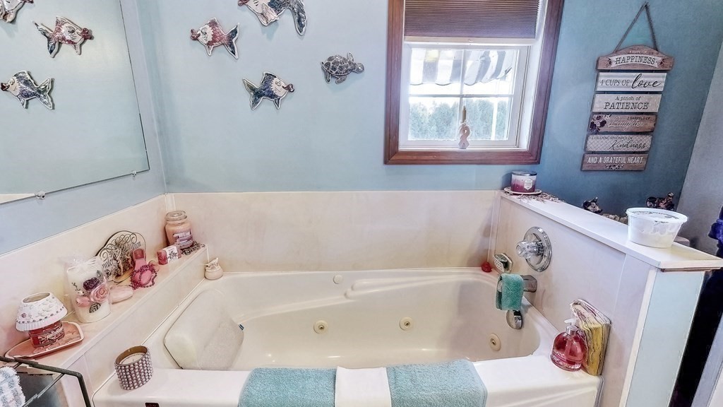 59 Scenic Road Westfield, MA 01085 - Photo 24 of 41 a bathroom with a bathtub and a window