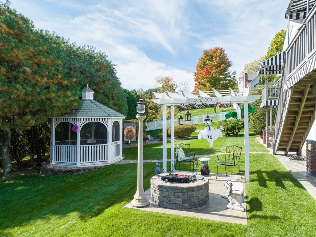 59 Scenic Road Westfield, MA 01085 - Photo 5 of 41 a front view of a house with a yard table and chairs
