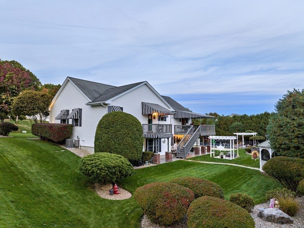 59 Scenic Road Westfield, MA 01085 - Photo 7 of 41 a front view of a house with a yard and trees