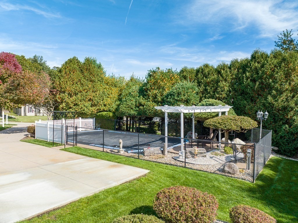 59 Scenic Road Westfield, MA 01085 - Photo 10 of 41 a swimming pool with outdoor seating and yard
