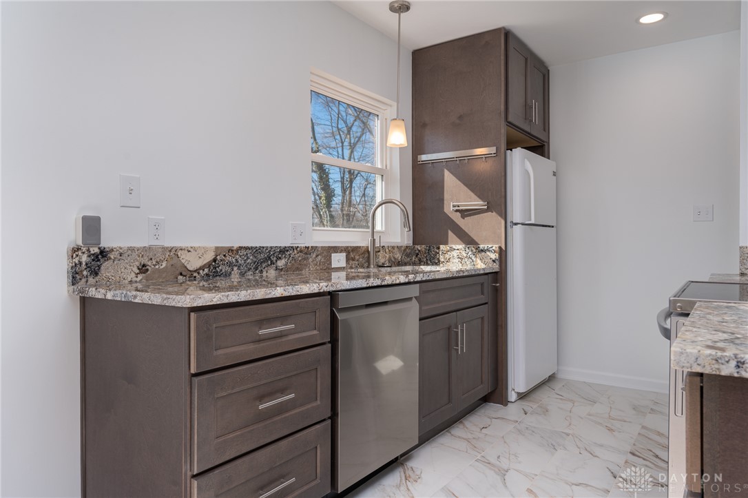 326 North Bromfield Road Kettering, OH 45429 - Photo 8 of 30 This bright kitchen features ample counter space and modern amenities, ideal for culinary endeavors.