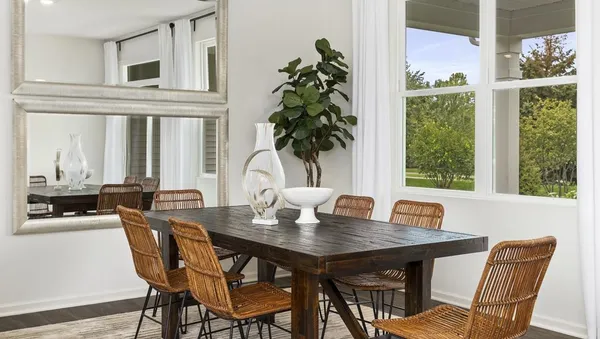 a view of a dining room with furniture window and outside view