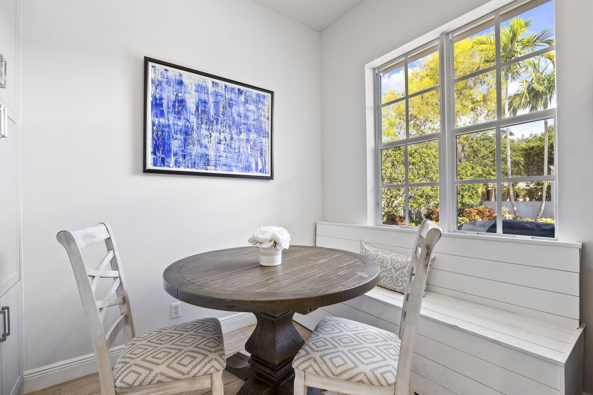 202 Botanica Drive Jupiter, FL 33458 - Photo 13 of 33 a view of a dining room with furniture and window